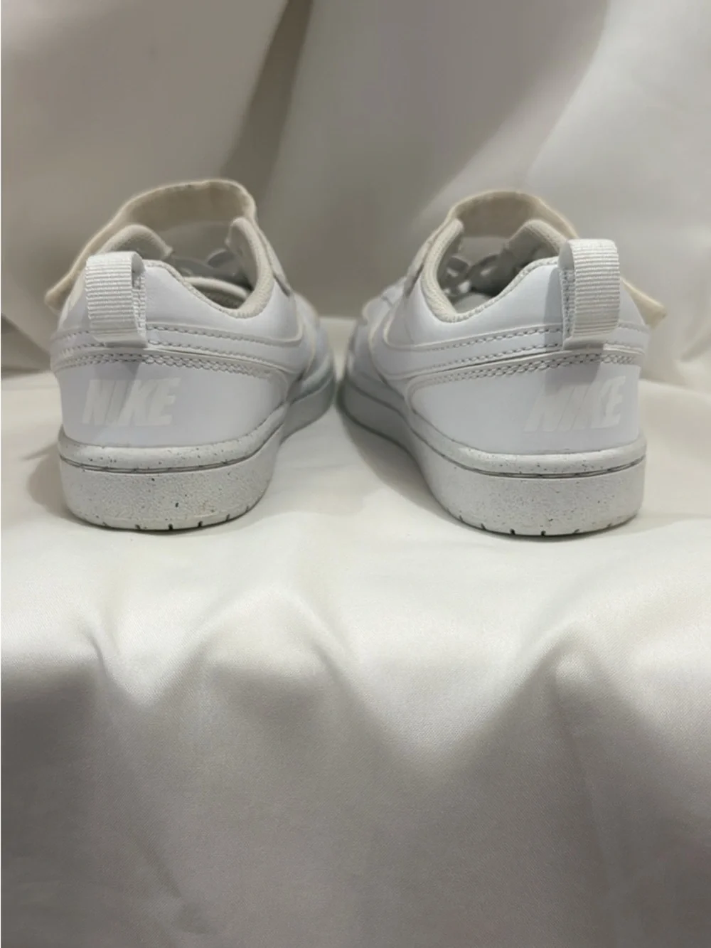 Boys white Nike sneakers